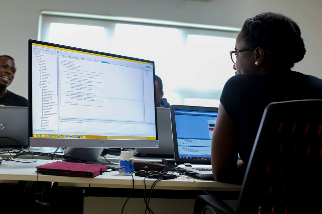 Female software developer working on her computer