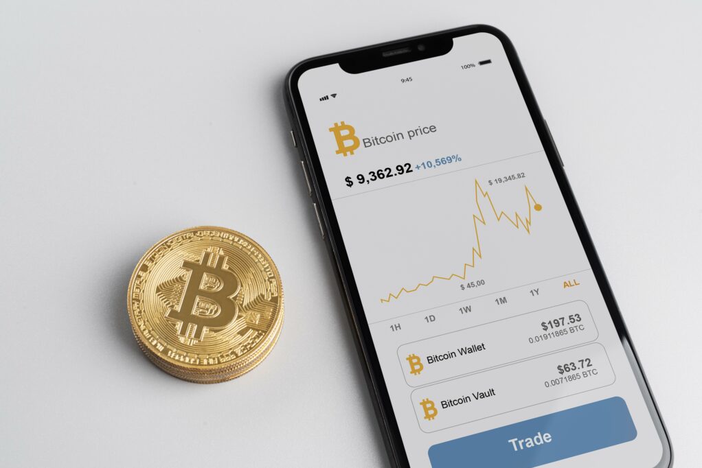 Mobile phone with crypto trading app opened on it