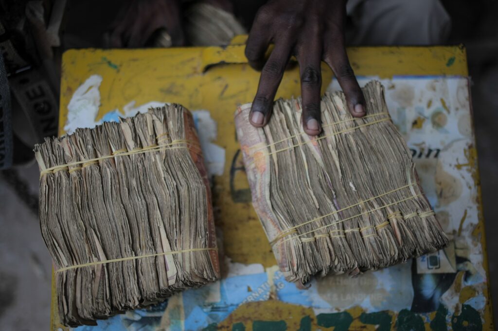 A picture of stacks of money. Used in this instance to depict huge sums of money for stuff like payments. student loans, trade among others