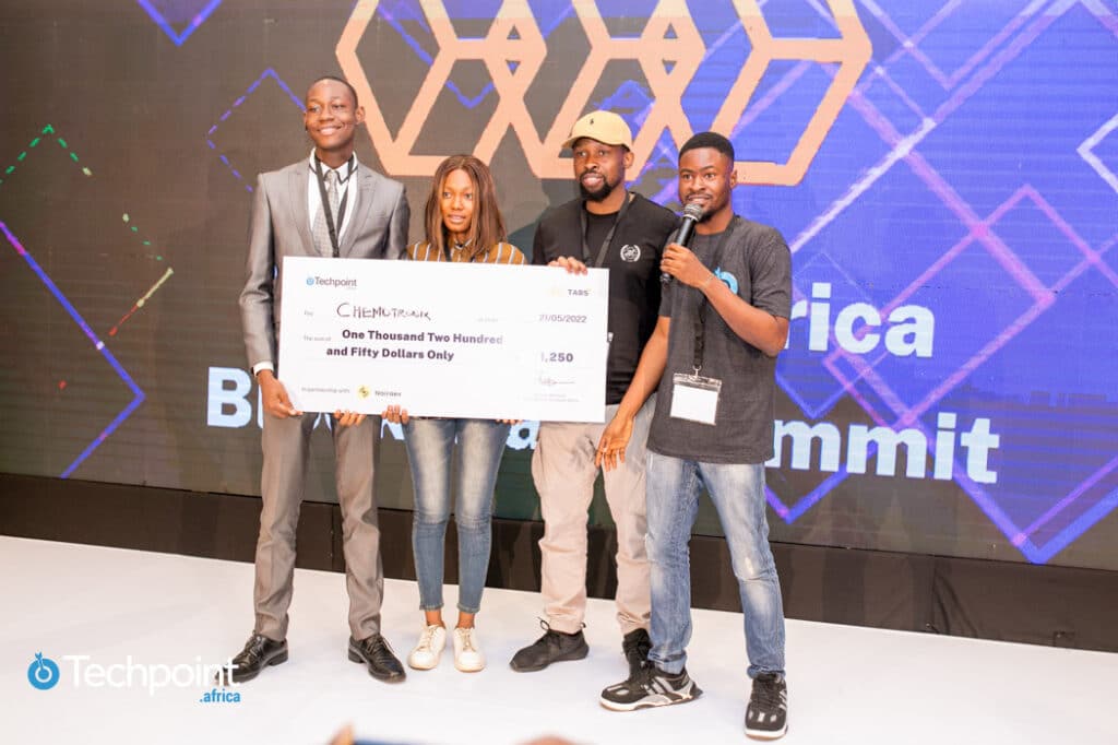 Team Chemotronix receiving cash prize with Ekene Egonu