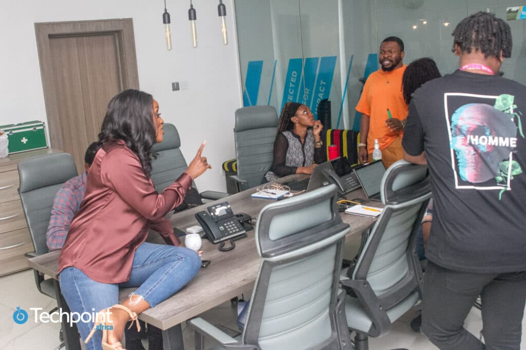 Weyinmi Barber having a bonding session with Softcom employees