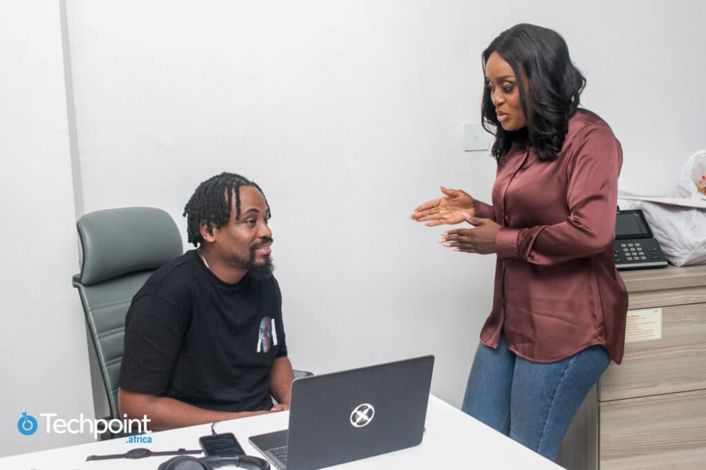 Weyinmi Barber chatting with Softcom Chief Operating Officer