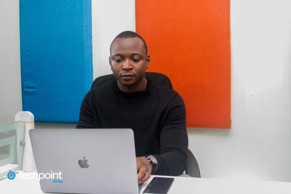 Seun Adeola working on his Macbook