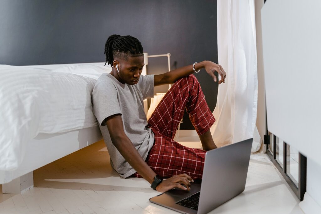 Young man working on a laptop "tech bro"