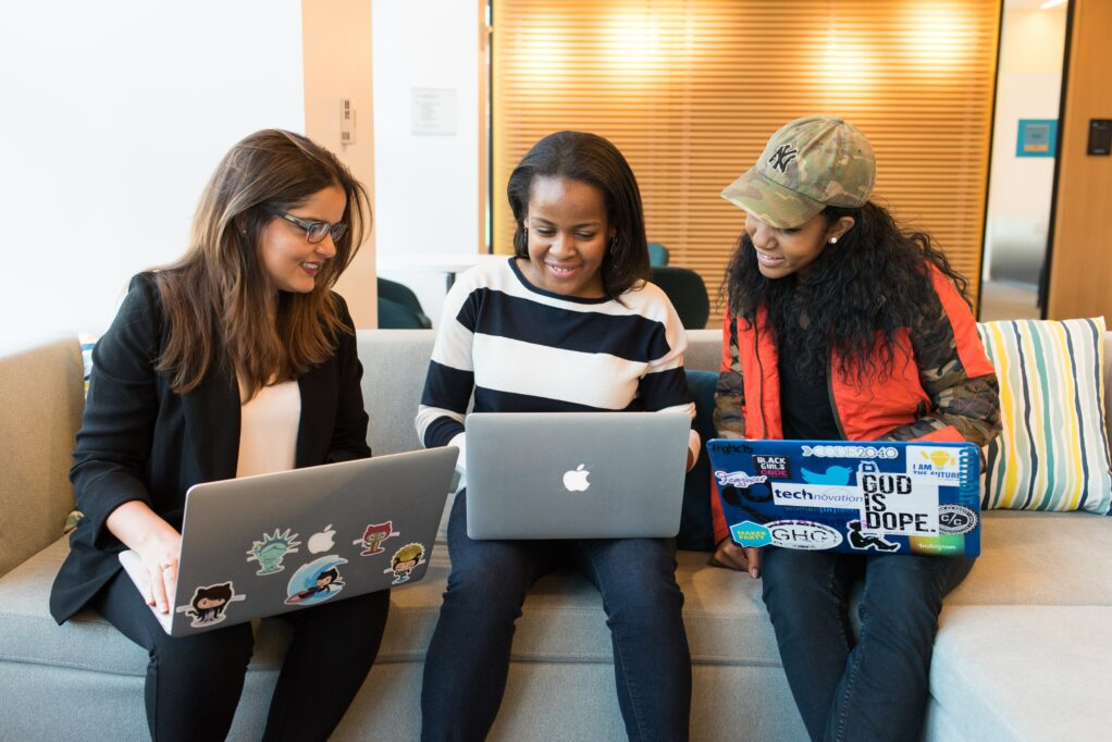 Three women working on computer