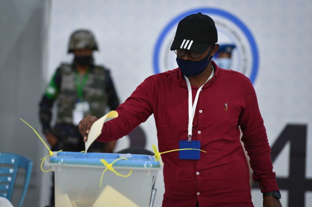 A man casting his votes at an election