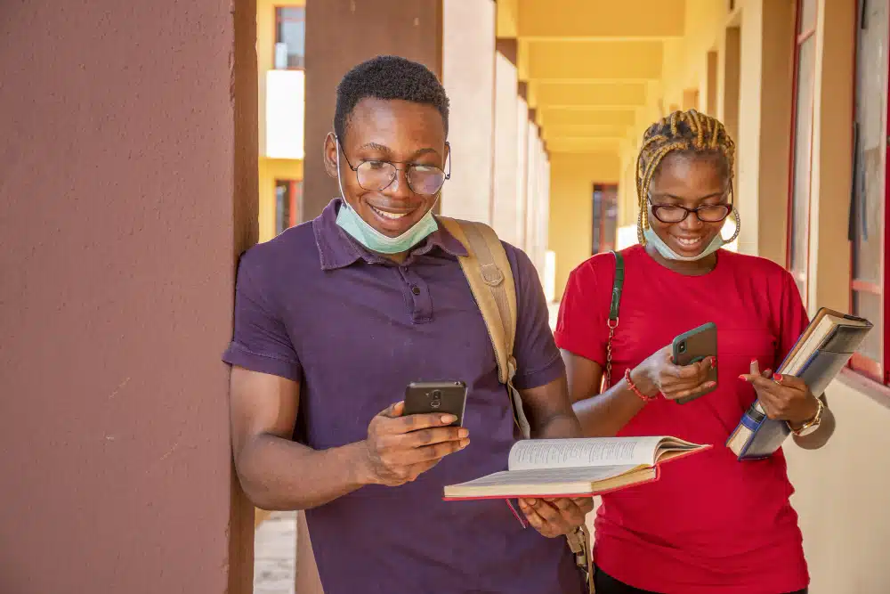 Students checking their jamb results via SMS