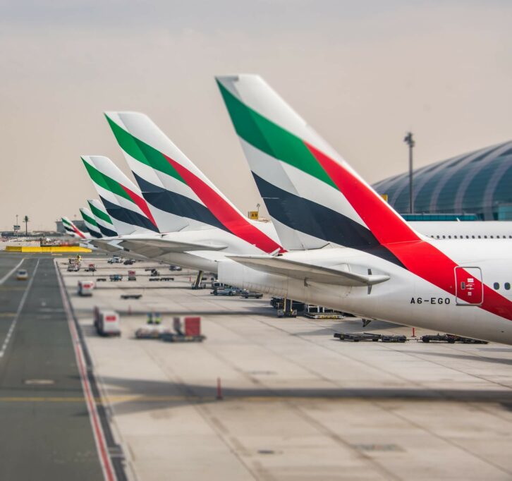 An image of airplanes parked in an airplane hanger