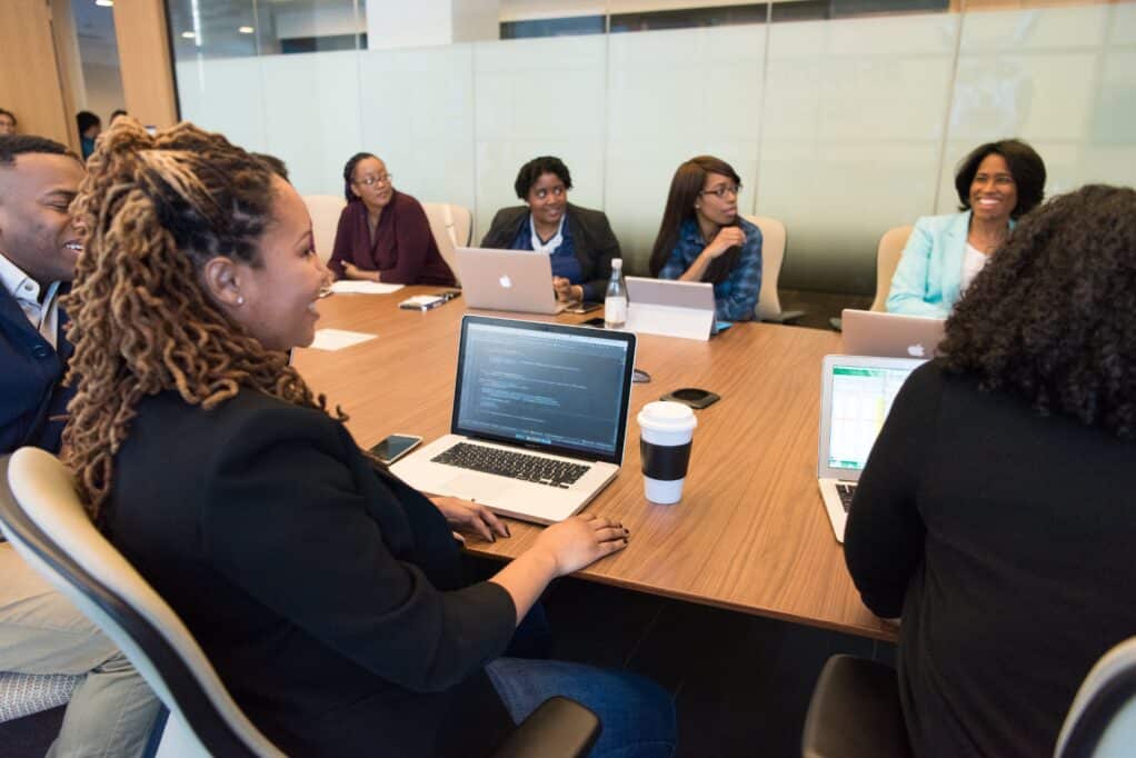 Black men and women sitting in an office