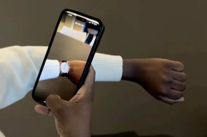 Someone using augmented reality to see what a watch will look on their wrist