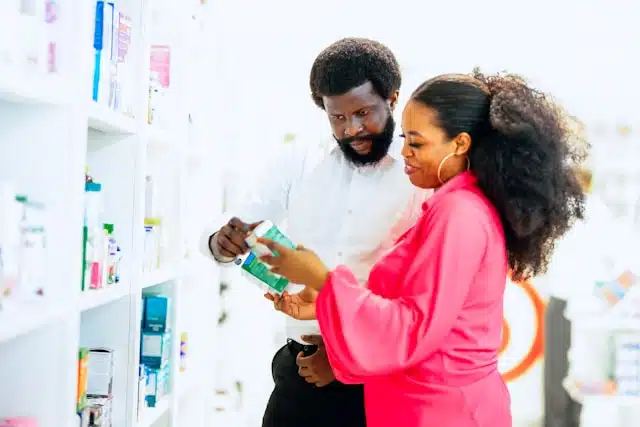two people in a pharmacy or drug store