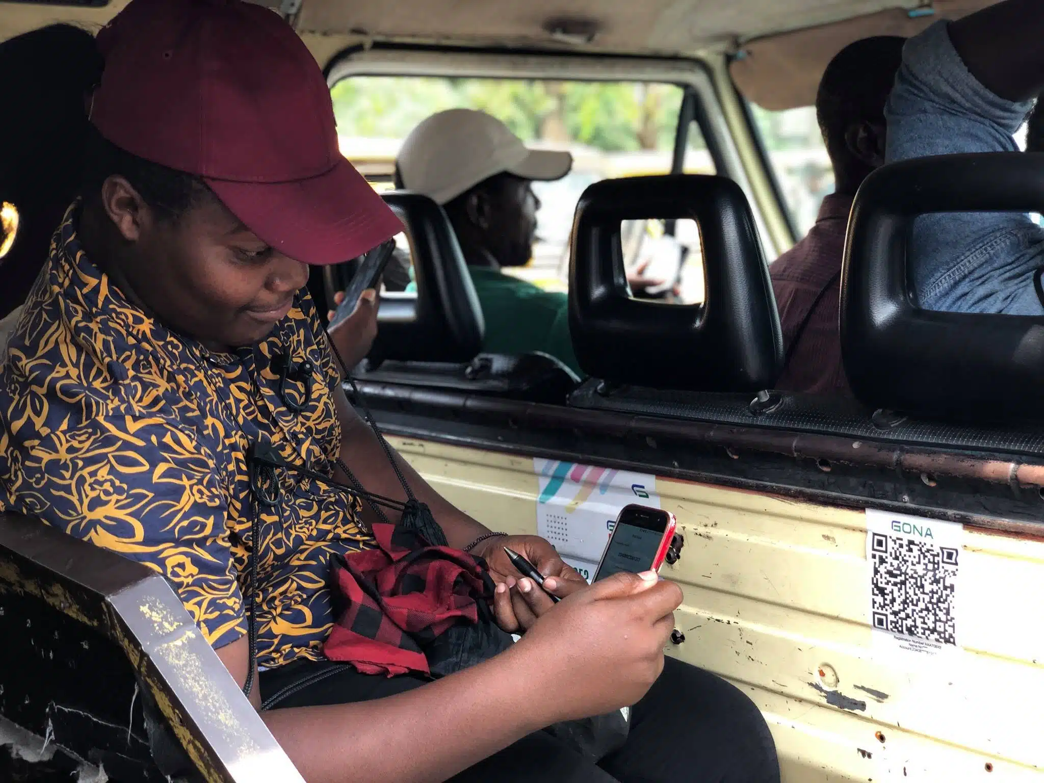 A danfo passenger scans GONA’s QR code |Techpoint.africa